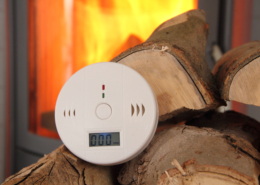 CO Detector in Front of a Burning Fireplace