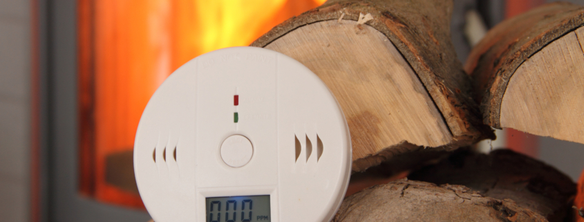 CO Detector in Front of a Burning Fireplace